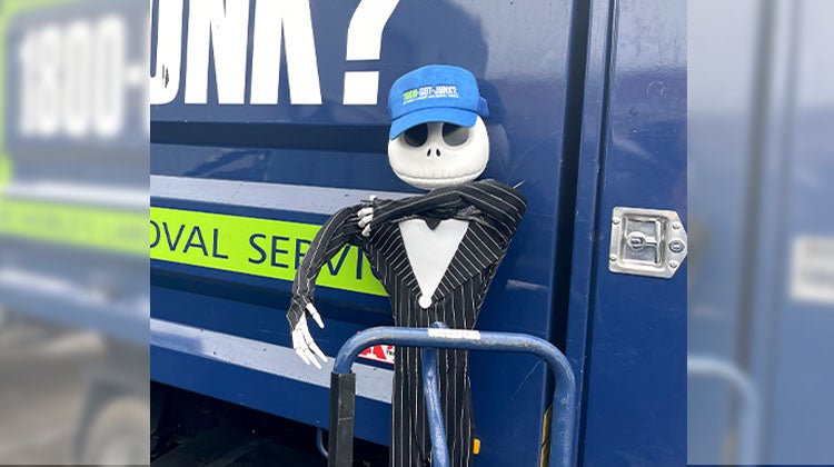 Junk Skellington Jack Skellington wheeling a dolly in front of 1-800-GOT-JUNK? truck