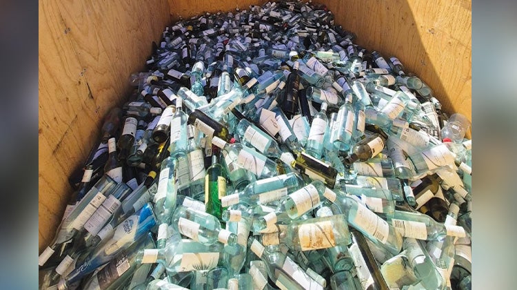 Weird Junk 2024 Wine Bottles The back of a 1-800-GOT-JUNK? truck filled with hundreds of empty wine bottles