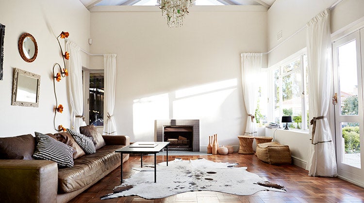 Brightly lit living room with chandelier Brightly lit living room with chandelier