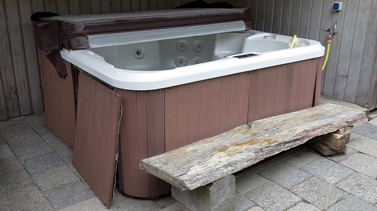 How to get rid of an old hot tub Old drained hot tub with top half off and side pannels removed