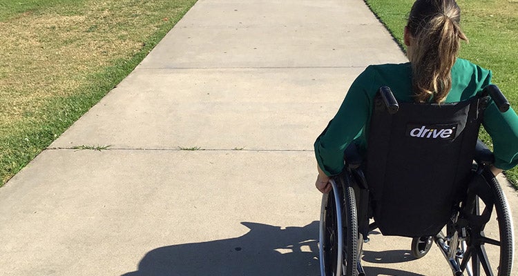 Woman in black wheelchair Woman in black wheelchair