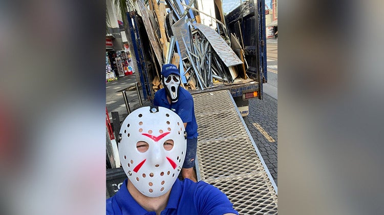 1-800-GOT-JUNK? team members wearing Jason Vorhees and Scream masks 1-800-GOT-JUNK? team members wearing Jason Vorhees and Scream masks